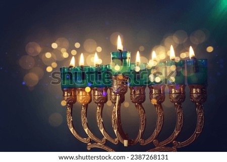 Religion image of jewish holiday Hanukkah background with menorah (traditional candelabra) and candles Royalty-Free Stock Photo #2387268131