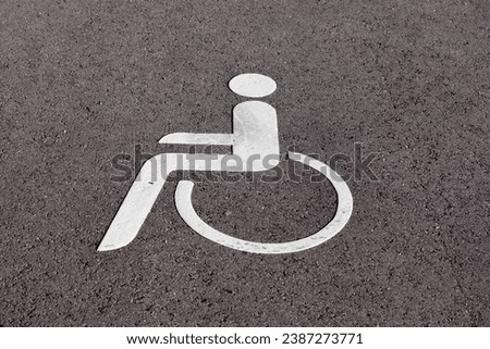 parking space for disabled people. disabled parking icon in the parking lot Royalty-Free Stock Photo #2387273771