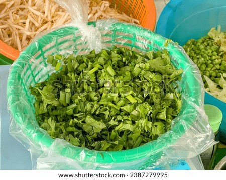 fresh green vegetables in a plastic bag.