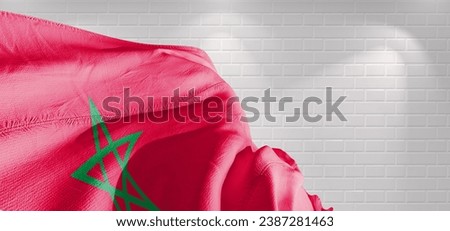 Morocco national flag cloth fabric waving on beautiful light Background. Royalty-Free Stock Photo #2387281463