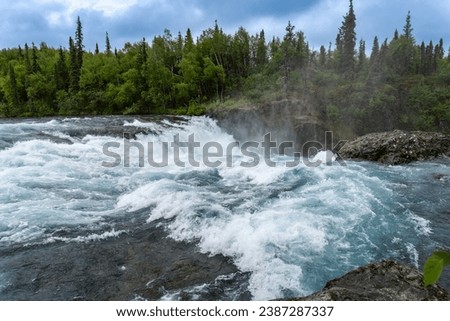 Lake Clark National Park in Alaska. Tanalian Falls and river. Spruce trees, rugged mountains and popular day hike area near Port Alsworth. Royalty-Free Stock Photo #2387287337