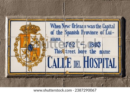 old street name Calle del hospital on tiles in the French quarter in New Orleans, Louisiana, USA
