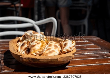 Delicious empanadas from Salta. Huge plate full of Argentine empanadas. Typical Argentine dish. Typical dish from northern Argentina Royalty-Free Stock Photo #2387307035