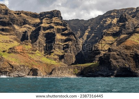 The beautiful Napali Coast from a tour boat off of the shore of Kauai, Hawaii, United States.
 Royalty-Free Stock Photo #2387316445