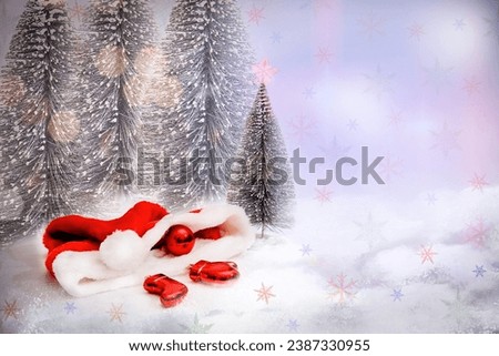 Santa Claus hat with Christmas red toys Winter Christmas background.