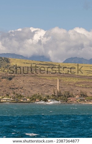Old sugar cane factory as seen from a boat on the Napali coast in Kauai Hawaii, United States. 
