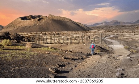 El Cuervo volcano, in the background the volcanoes of the Timanfaya National Park, Lanzarote, Spain Royalty-Free Stock Photo #2387369205