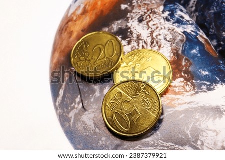 Earth map with a pin and money. Travel concept.