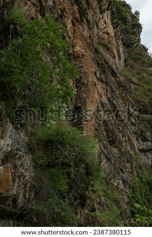 An old castle located in the mountainous region of Azerbaijan. Alpinists climbing to the castle. The view from the castle