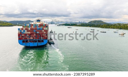 Panama Canal, Canal locks, Maritime Transit, container ship, Gatun Lake, climate change, Panama mining, tug Royalty-Free Stock Photo #2387395289