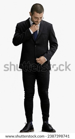 full-length portrait of a young man. standing isolated on white background