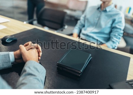Human resource team talking to a candidate during a job interview in the office.
