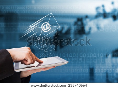 Business woman sending email by using digital tablet 