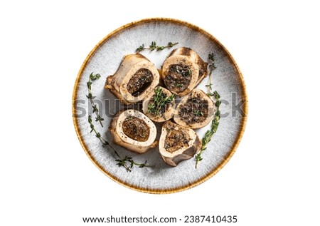 Baked marrow veal beef bones in plate with thyme and herbs. Isolated, white background. Top view Royalty-Free Stock Photo #2387410435