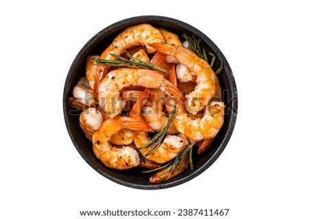 Roast Prawns Shrimps in a pan with herbs and garlic. Isolated, white background. Top view Royalty-Free Stock Photo #2387411467