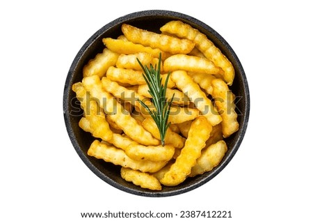 Fried Crinkle French fries potatoes in a pan. Isolated, white background. Top view Royalty-Free Stock Photo #2387412221