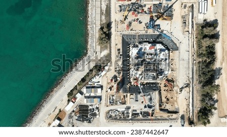 Aerial drone photo of construction site of famous Riviera tower 200 meter skyscraper that is to be completed by 2025 and expensive area of the Ellinikon project, South Athens riviera, Attica, Greece Royalty-Free Stock Photo #2387442647