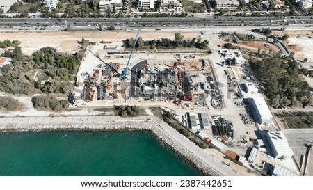 Aerial drone photo of construction site of famous Riviera tower 200 meter skyscraper that is to be completed by 2025 and expensive area of the Ellinikon project, South Athens riviera, Attica, Greece Royalty-Free Stock Photo #2387442651