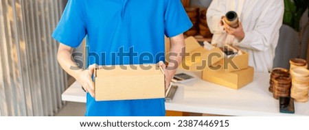 Banner of delivery post man holding box, standing, sending parcel to home or residence with copy space for advertisement