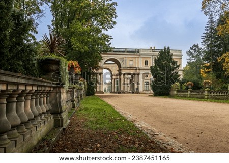 The Orangery in the Sanssouci Palace Park. with autumnal flowers Royalty-Free Stock Photo #2387451165