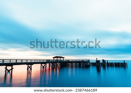 A long exposure photo of a pier during sunset. Shot on the Sunshine Coast of British Columbia 