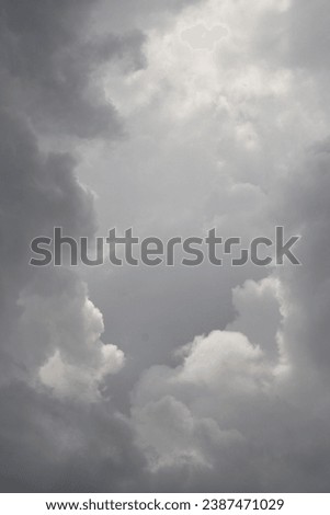 Bright afternoon clouds in the sky sun rays bursting through the sky the Lord looks down creation magnificence nature's beauty and fantastic view and vista the heavens declare the glory of God  Royalty-Free Stock Photo #2387471029