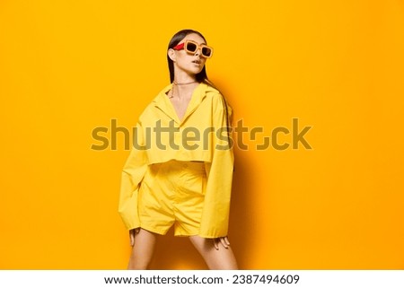 lifestyle woman fashion yellow sunglasses attractive funny girl trendy beautiful young Royalty-Free Stock Photo #2387494609