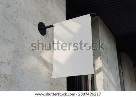 Storefront kakemono Mockup. White Shop sign on a wall in a street template