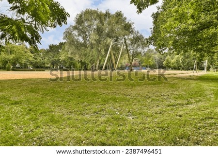 an empty park with trees and grass in the fore - image was taken from google street, south london stock photo