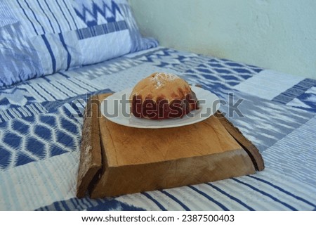 Dream of a bakery stuffed with guava being served on the white porcelain plate on the rustic wooden board