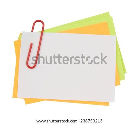 Multi color note with red paper clip isolated clipping path