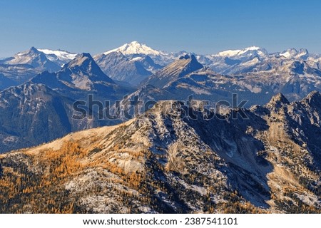 Mt Baker, Shuksan, and The North Cascades  Viewed From the Summit of Golden Horn. 
Pacific Crest Trail, North Cascades National Park, Washington. Royalty-Free Stock Photo #2387541101