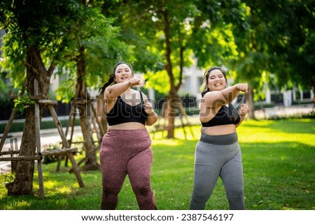 An obese woman who turns to exercise to take care of her health and lose weight on the lawn in a fun way.
