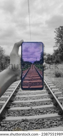 Railway track aesthetic picture with phone