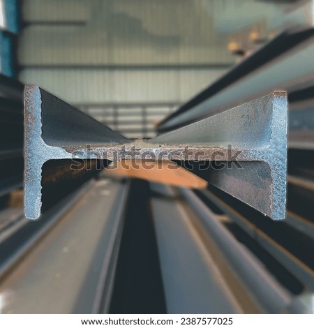 products of the plant for the production of metal structures. Welded I-beam and H-Beams. Royalty-Free Stock Photo #2387577025
