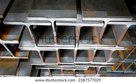 products of the plant for the production of metal structures. Welded I-beam and H-Beams. Royalty-Free Stock Photo #2387577029