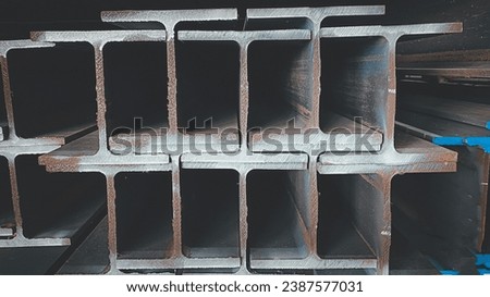 products of the plant for the production of metal structures. Welded I-beam and H-Beams. Royalty-Free Stock Photo #2387577031