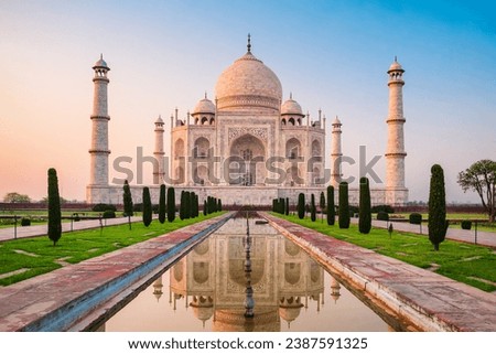 Taj Mahal is a white marble mausoleum on the bank of the Yamuna river in Agra city, Uttar Pradesh state, India Royalty-Free Stock Photo #2387591325