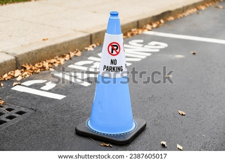 No Parking sign against an urban backdrop, a symbol of restricted access and order in the city