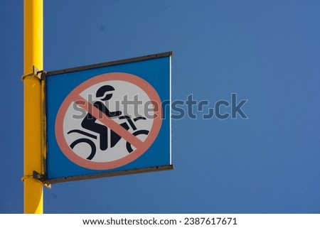 No Motorcycle Riding Sign, Blue Background