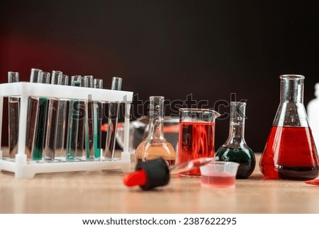 chemical concept at group of flasks with different colored liquid. Chemical reaction