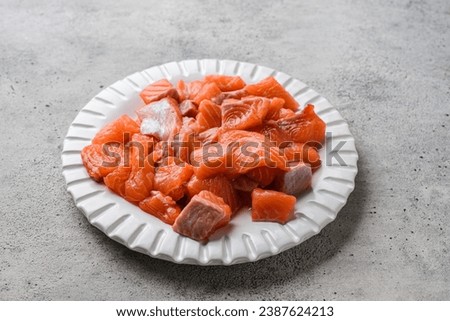 raw salmon on a gray background in a plate. High quality photo