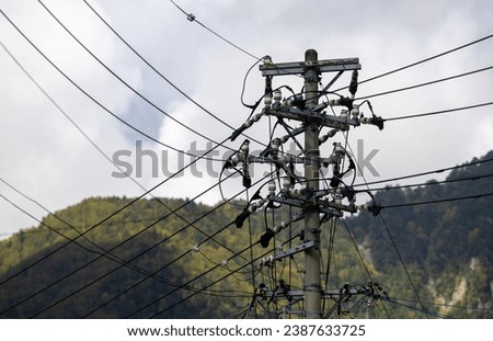 A lot of electric wires on a pole, electricity transmission in Japan Royalty-Free Stock Photo #2387633725