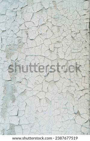 Old peeling paint on the wall. Abstract background.
