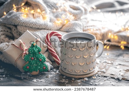 Winter composition with a cup of cocoa and decorative details.