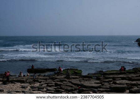 photos of people on holiday at the beach, photos of the stretch of Klayar beach in Pacitan, East Java, Indonesia