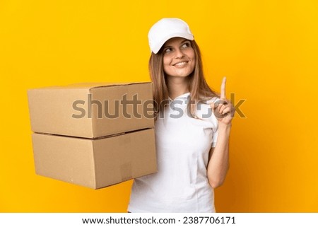 Young Slovak delivery woman isolated on yellow background pointing up a great idea