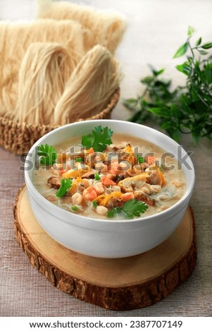 traditional chinese healthy braised puritan noodle with clam prawn seafood thick soup in bowl on grey vintage background cafe hotel luxury halal food restaurant banquet menu Royalty-Free Stock Photo #2387707149