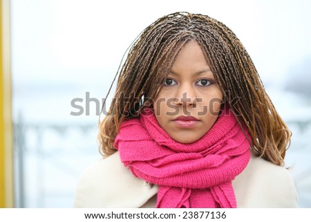 close-up portrait of the young woman with red scarf