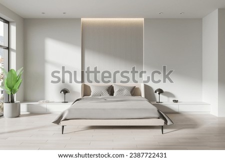 White modern hotel bedroom interior with bed, drawer with decoration and plant on hardwood floor. Relaxing space with panoramic window on tropics. 3D rendering Royalty-Free Stock Photo #2387722431